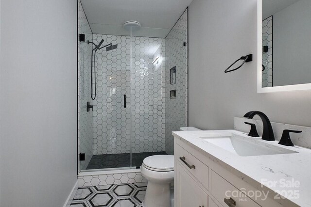 327 Wilkes Place Dr, Fort Mill, SC 29715 - bathroom with a stall shower, toilet, vanity, and tile patterned flooring
