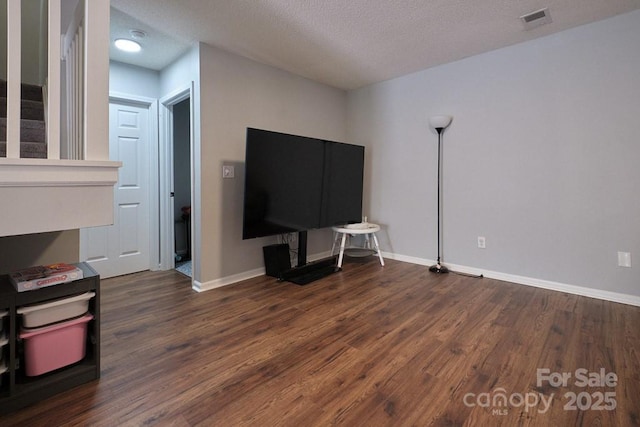 327 Wilkes Place Dr, Fort Mill, SC 29715 - living room with wood finished floors, baseboards, and a textured ceiling