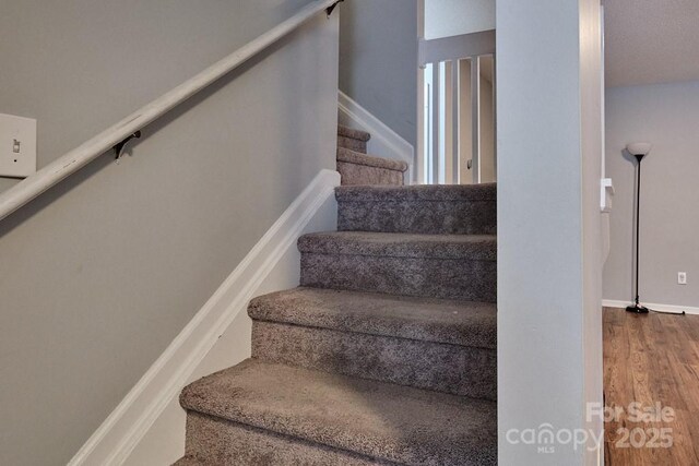 327 Wilkes Place Dr, Fort Mill, SC 29715 - stairs with wood finished floors and baseboards