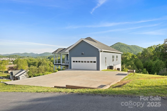505 Sky Ridge Dr Unit 57, Leicester, NC 28748 - view of front of property with a mountain view, central AC unit, and an attached garage