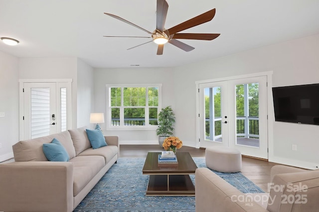 505 Sky Ridge Dr Unit 57, Leicester, NC 28748 - living room featuring a ceiling fan, wood finished floors, baseboards, and french doors