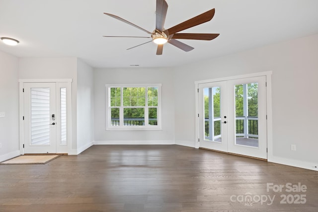 505 Sky Ridge Dr Unit 57, Leicester, NC 28748 - unfurnished living room with ceiling fan, dark wood-style flooring, french doors, and baseboards