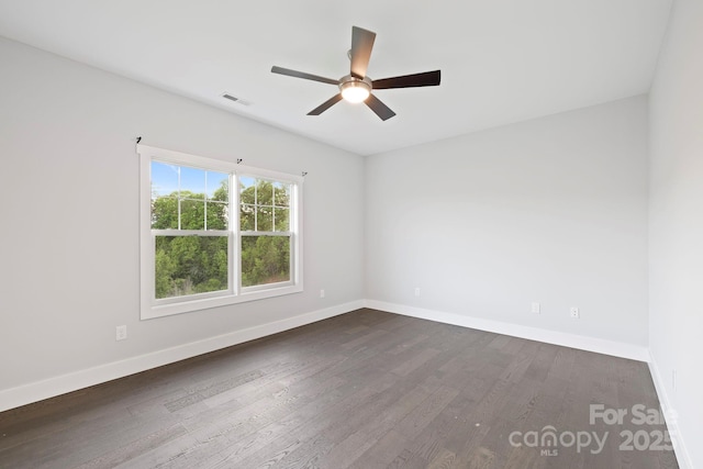505 Sky Ridge Dr Unit 57, Leicester, NC 28748 - empty room with a ceiling fan, dark wood-style floors, and baseboards