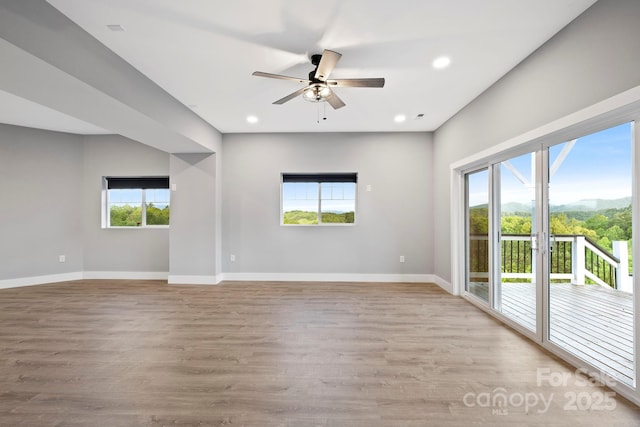 505 Sky Ridge Dr Unit 57, Leicester, NC 28748 - spare room featuring plenty of natural light, ceiling fan, baseboards, light wood-style floors, and recessed lighting