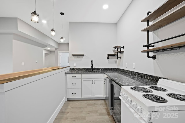 505 Sky Ridge Dr Unit 57, Leicester, NC 28748 - kitchen featuring white range with electric cooktop, a sink, light wood-style floors, wine cooler, and white cabinets