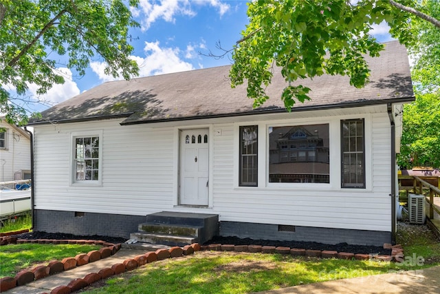 cape cod-style house featuring crawl space and roof with shingles
