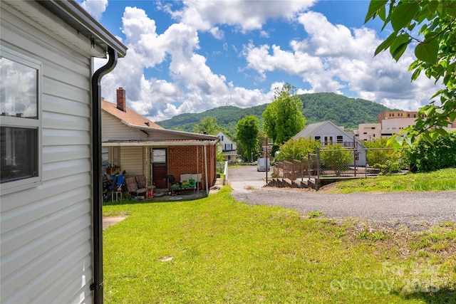 view of yard with a mountain view and a patio
