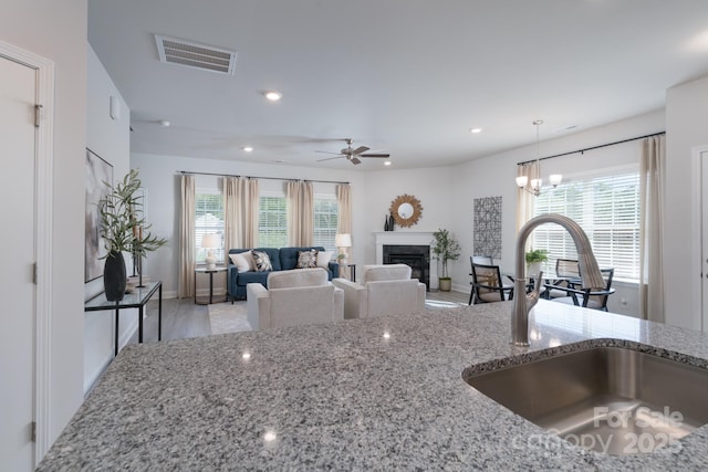 4045 Port Richmond Ave Unit 10, Gastonia, NC 28056 - kitchen with a sink, light stone counters, plenty of natural light, and recessed lighting