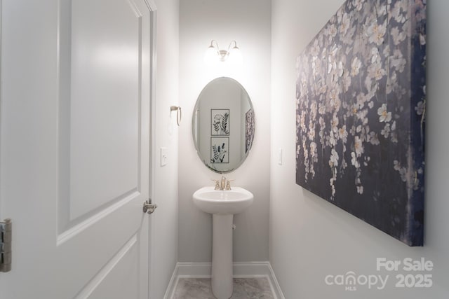 4045 Port Richmond Ave Unit 10, Gastonia, NC 28056 - bathroom featuring baseboards and a sink