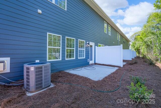 4045 Port Richmond Ave Unit 10, Gastonia, NC 28056 - rear view of house featuring central air condition unit, a patio area, and fence