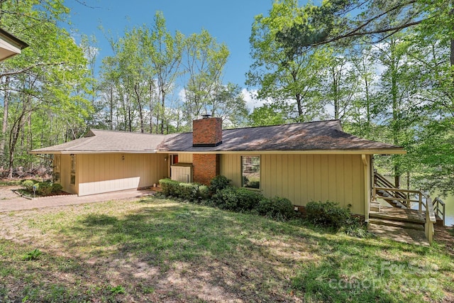 334 Lakeview Cir, Lugoff, SC 29078 - view of front of home with a chimney and a front lawn