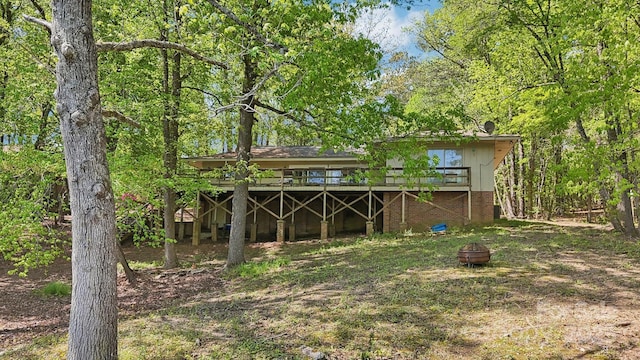 334 Lakeview Cir, Lugoff, SC 29078 - back of house with a fire pit and a deck