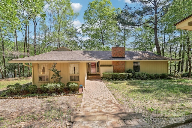 334 Lakeview Cir, Lugoff, SC 29078 - view of front facade with a chimney and a front yard