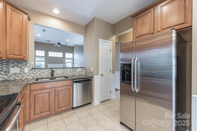 165 N Arcadian Way, Mooresville, NC 28117 - kitchen with stainless steel appliances, ceiling fan, a sink, brown cabinetry, and recessed lighting