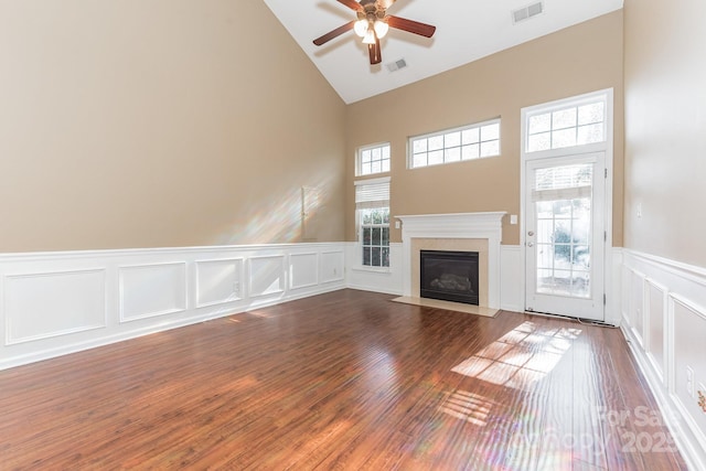 165 N Arcadian Way, Mooresville, NC 28117 - unfurnished living room with high vaulted ceiling, a ceiling fan, a fireplace with flush hearth, a decorative wall, and a wainscoted wall