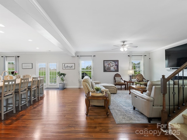 2178 Stone Pile Dr SW, Concord, NC 28025 - living area featuring wood finished floors, healthy amount of natural light, ceiling fan, crown molding, and stairs
