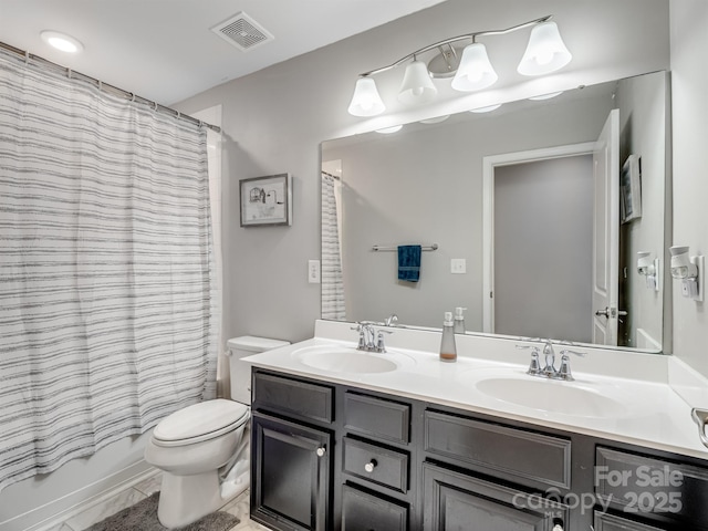 2178 Stone Pile Dr SW, Concord, NC 28025 - bathroom featuring toilet, double vanity, and shower / tub combo with curtain