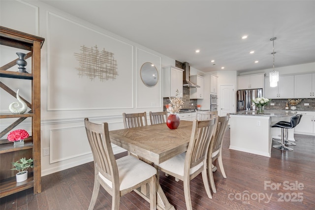 1033 Dorsey Dr, Fort Mill, SC 29715 - dining room with a decorative wall, dark wood-style flooring, and recessed lighting