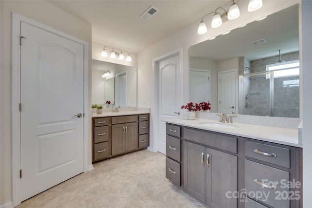 1033 Dorsey Dr, Fort Mill, SC 29715 - bathroom featuring a stall shower, two vanities, and tile patterned floors