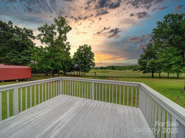 1155 Hasty Rd, Peachland, NC 28133 - deck at dusk featuring a lawn