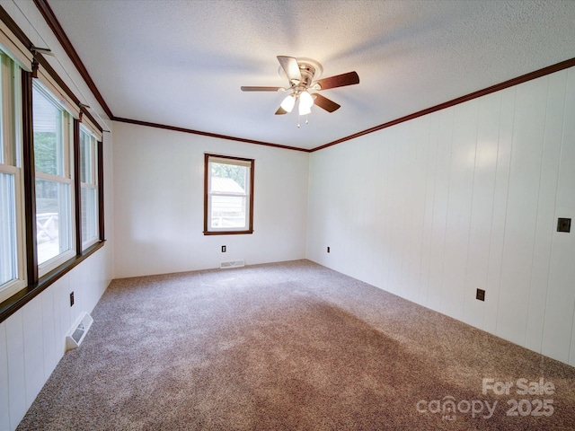 1155 Hasty Rd, Peachland, NC 28133 - spare room with carpet flooring, ceiling fan, crown molding, and a textured ceiling