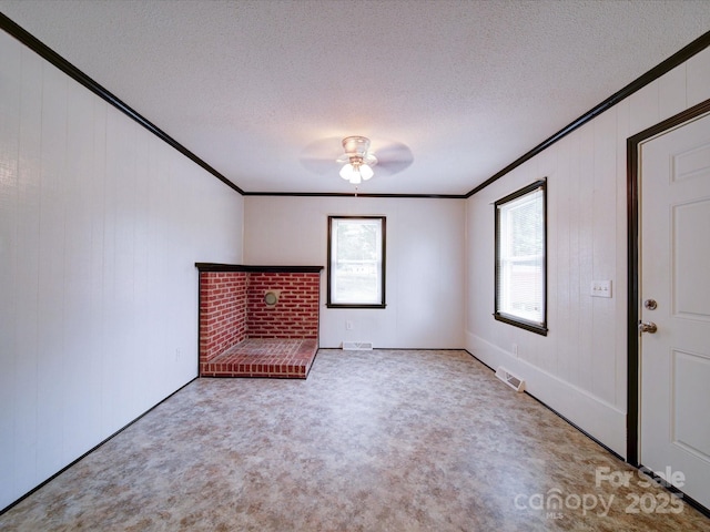1155 Hasty Rd, Peachland, NC 28133 - unfurnished room with crown molding, carpet flooring, a ceiling fan, and a textured ceiling