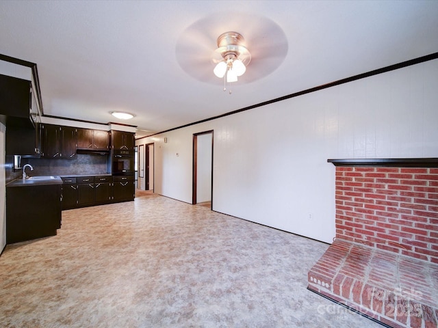 1155 Hasty Rd, Peachland, NC 28133 - unfurnished living room with ornamental molding, a ceiling fan, and a sink
