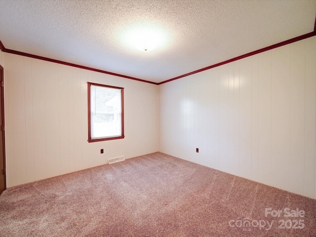 1155 Hasty Rd, Peachland, NC 28133 - unfurnished room featuring carpet flooring, crown molding, and a textured ceiling