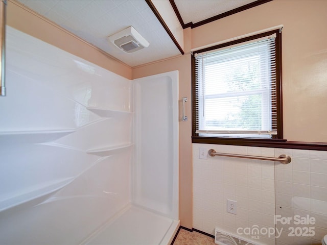 1155 Hasty Rd, Peachland, NC 28133 - bathroom with a shower, crown molding, and wainscoting
