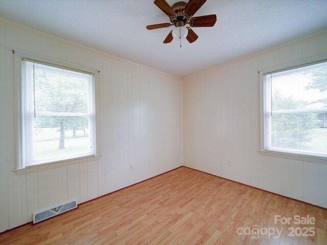 1155 Hasty Rd, Peachland, NC 28133 - spare room with wood finished floors, healthy amount of natural light, ornamental molding, and a ceiling fan