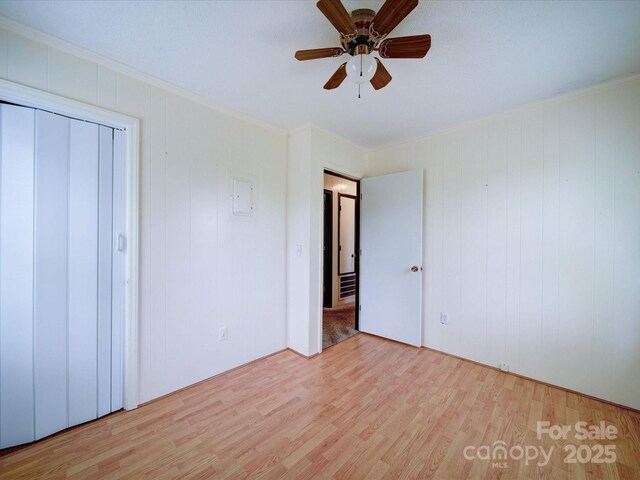 1155 Hasty Rd, Peachland, NC 28133 - unfurnished bedroom with wood finished floors, crown molding, and a ceiling fan