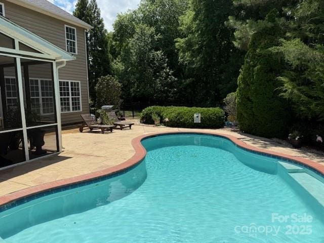 outdoor pool with a patio