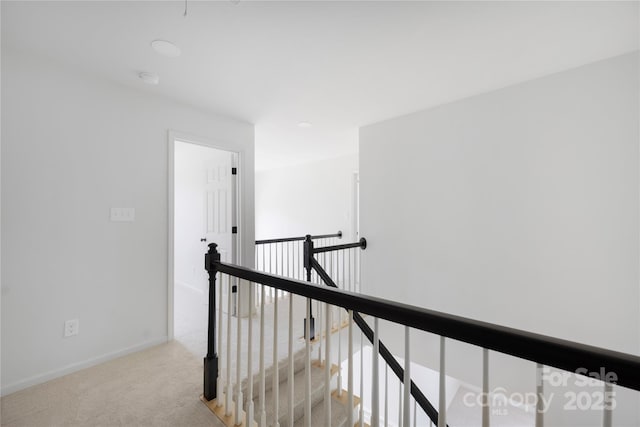 6504 Sybil Ct, Indian Trail, NC 28079 - corridor with an upstairs landing, light colored carpet, and baseboards