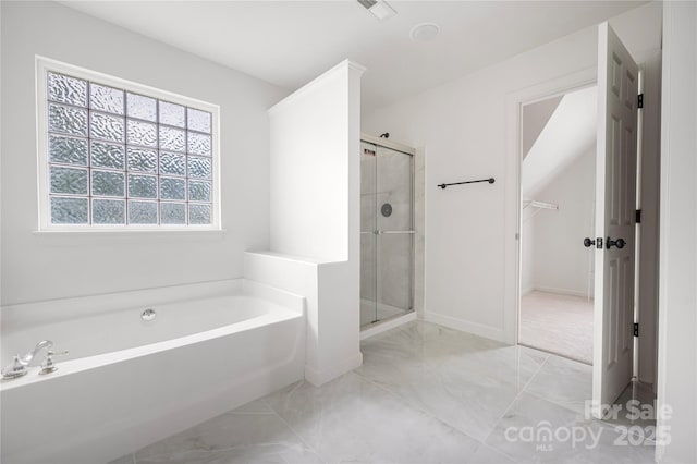 6504 Sybil Ct, Indian Trail, NC 28079 - full bathroom with a garden tub, a stall shower, marble look tiles, and baseboards