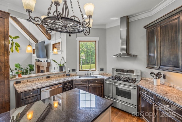 270 Sandhills Ct, Mooresville, NC 28115 - kitchen featuring appliances with stainless steel finishes, wall chimney range hood, a chandelier, a sink, and dark brown cabinets