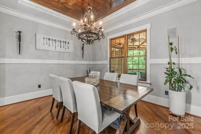 270 Sandhills Ct, Mooresville, NC 28115 - dining area with a chandelier, a raised ceiling, ornamental molding, wood finished floors, and baseboards