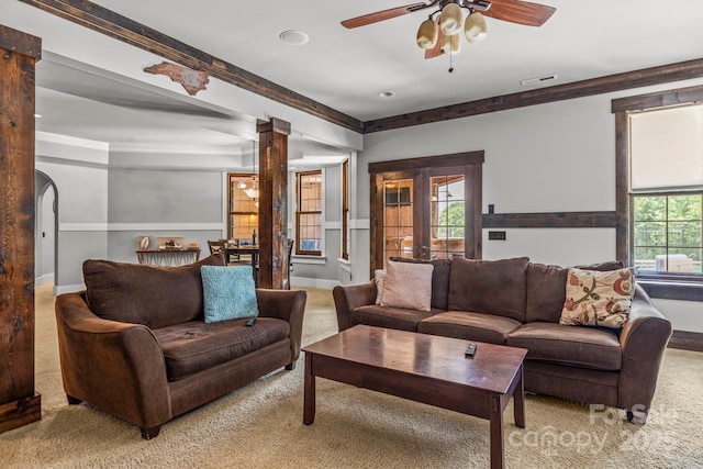 270 Sandhills Ct, Mooresville, NC 28115 - living room featuring light colored carpet, ornate columns, ceiling fan, ornamental molding, and baseboards