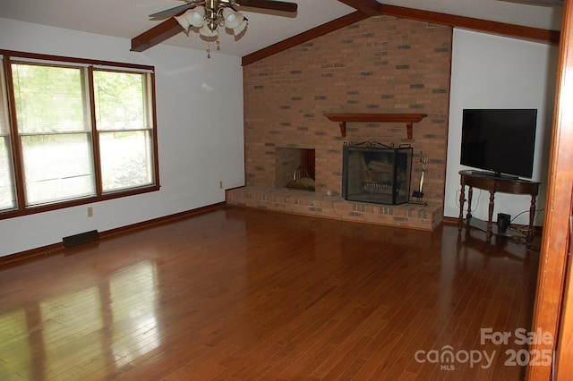 unfurnished living room with ceiling fan, baseboards, a fireplace, and wood finished floors