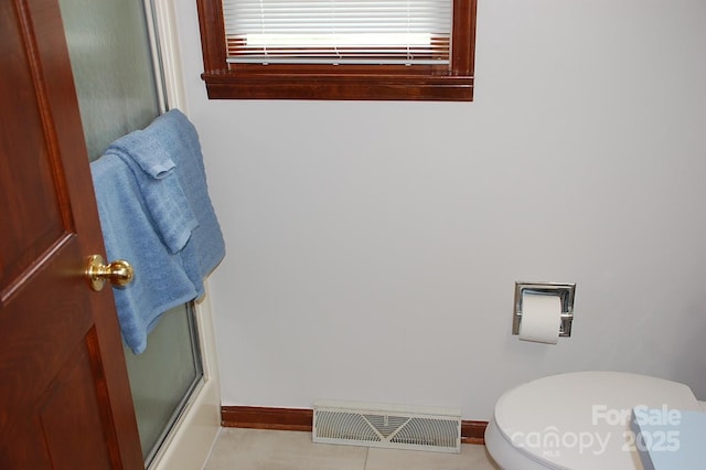 full bathroom with toilet, baseboards, and enclosed tub / shower combo