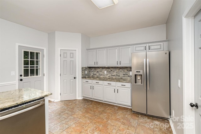 17318 Cambridge Grove Dr, Huntersville, NC 28078 - kitchen with stainless steel appliances, light stone countertops, stone finish flooring, backsplash, and baseboards