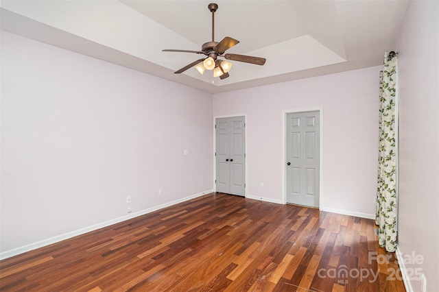 17318 Cambridge Grove Dr, Huntersville, NC 28078 - unfurnished bedroom featuring wood finished floors, baseboards, a raised ceiling, and ceiling fan