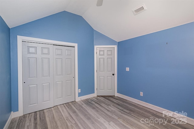17318 Cambridge Grove Dr, Huntersville, NC 28078 - unfurnished bedroom with vaulted ceiling, wood finished floors, baseboards, a closet, and ceiling fan