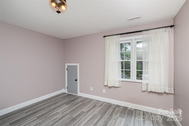 17318 Cambridge Grove Dr, Huntersville, NC 28078 - empty room featuring wood finished floors and baseboards