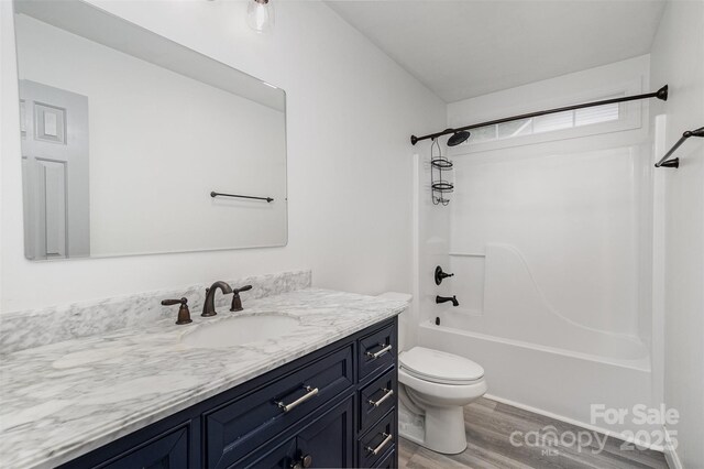 17318 Cambridge Grove Dr, Huntersville, NC 28078 - bathroom featuring wood finished floors, toilet, vanity, and shower / washtub combination