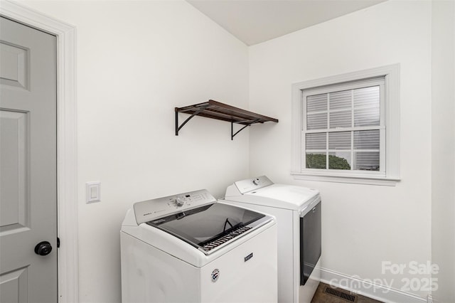 17318 Cambridge Grove Dr, Huntersville, NC 28078 - laundry area with washer and clothes dryer and baseboards