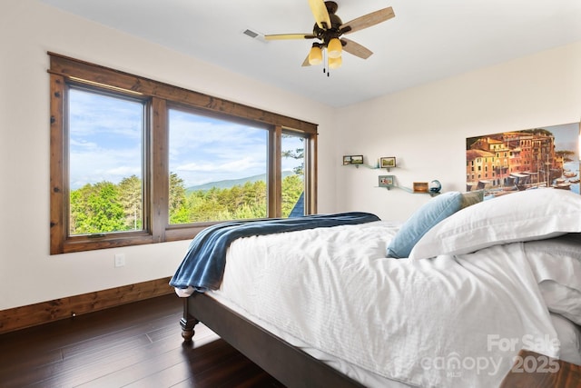 bedroom with hardwood / wood-style flooring and ceiling fan