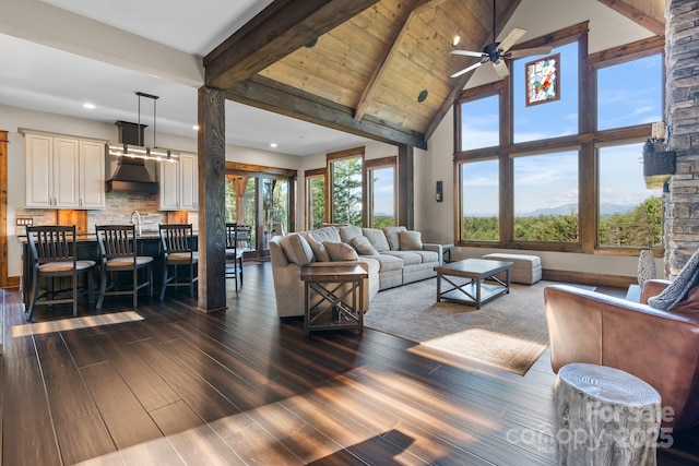 2775 Campbells Trce, Nebo, NC 28761 - living area featuring dark wood-style floors, beam ceiling, ceiling fan, recessed lighting, and high vaulted ceiling