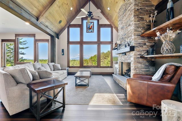 2775 Campbells Trce, Nebo, NC 28761 - living area featuring wood finished floors, healthy amount of natural light, a stone fireplace, high vaulted ceiling, and a wood ceiling with exposed beams