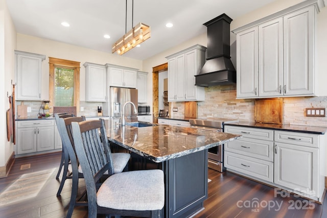 2775 Campbells Trce, Nebo, NC 28761 - kitchen featuring stainless steel appliances, premium range hood, dark wood-type flooring, a breakfast bar, and tasteful backsplash