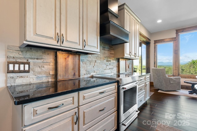 2775 Campbells Trce, Nebo, NC 28761 - kitchen with stainless steel range with electric stovetop, custom exhaust hood, dark countertops, dark wood-style floors, and backsplash